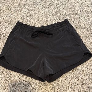 Athleta Seasoft Midrise Shorts, 4 inch, black. Size small, NWOT.